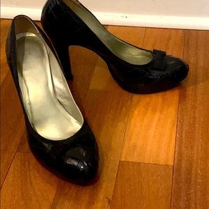 Black patent leather with velvet bow.